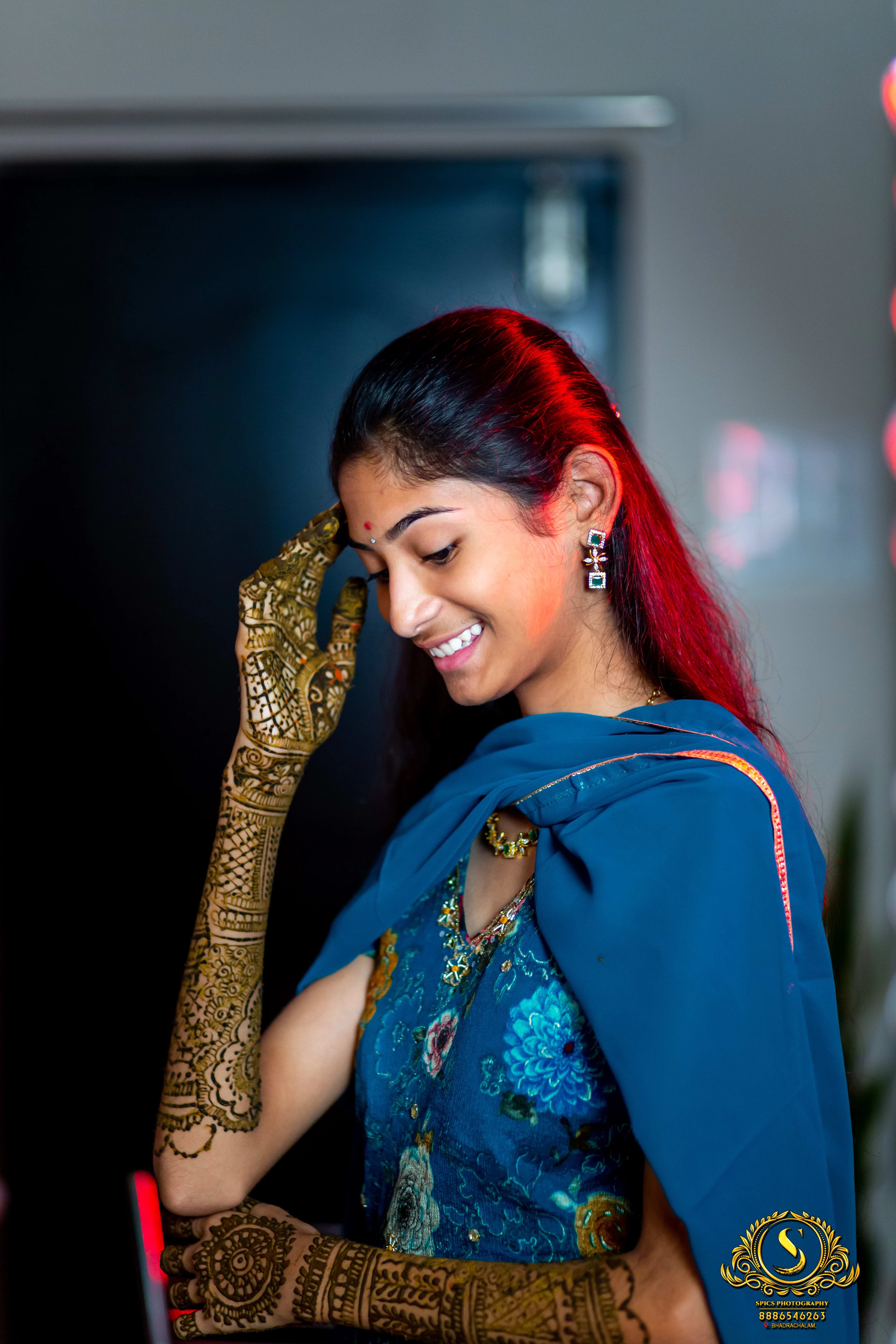 Mehandi ceremony with bride having henna applied